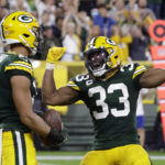 
              Green Bay Packers wide receiver Allen Lazard (13) celebrates with teammate running back Aaron Jones (33) after catching a 5-yard touchdown pass during the first half of an NFL football game against the Chicago Bears Sunday, Sept. 18, 2022, in Green Bay, Wis. (AP Photo/Mike Roemer)
            