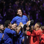 
              Team Europe's Roger Federer is lifted by fellow players after playing with Rafael Nadal in a Laver Cup doubles match against Team World's Jack Sock and Frances Tiafoe at the O2 arena in London, Friday, Sept. 23, 2022. Federer's losing doubles match with Nadal marked the end of an illustrious career that included 20 Grand Slam titles and a role as a statesman for tennis. (AP Photo/Kin Cheung)
            