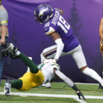 
              Minnesota Vikings wide receiver Justin Jefferson (18) breaks a tackle by Green Bay Packers safety Adrian Amos during a 36-yard touchdown reception during the first half of an NFL football game, Sunday, Sept. 11, 2022, in Minneapolis. (AP Photo/Bruce Kluckhohn)
            