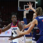 
              United States' Chelsea Gray runs at Serbia's Mina Dordevic during their quarterfinal game at the women's Basketball World Cup in Sydney, Australia, Thursday, Sept. 29, 2022. (AP Photo/Mark Baker)
            