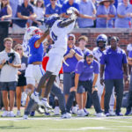 
              TCU safety Abe Camara, right, intercepts a pass as SMU wide receiver Jake Bailey, left, defends during the first half of an NCAA college game on Saturday, Sept. 24, 2022, in Dallas, Texas. (AP Photo/Gareth Patterson)
            