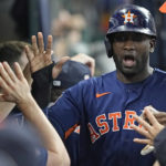 
              Houston Astros' Yordan Alvarez celebrates in the dugout after scoring against the Oakland Athletics during the third inning of a baseball game Sunday, Sept. 18, 2022, in Houston. (AP Photo/David J. Phillip)
            
