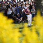 
              Cameron Smith hits his approach shot to the 18th green from the rough and next to a tree during the final round of the LIV Golf Invitational-Chicago tournament Sunday, Sept. 18, 2022, in Sugar Hill, Ill. (AP Photo/Charles Rex Arbogast)
            