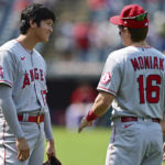 
              Los Angeles Angels' Shohei Ohtani, left, talk with Mickey Moniak before a baseball game against the Cleveland Guardians, Wednesday, Sept. 14, 2022, in Cleveland. (AP Photo/David Dermer)
            