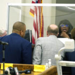 
              Hinds County Circuit Judge Adrienne Wooten, sits behind her protective barrier as she confers with the state's attorneys and defense attorneys for John Davis, former director of the Mississippi Department of Human Services in  Jackson, Miss., on Thursday, Sept. 22, 2022.   Davis pleaded guilty to new federal charges in a conspiracy to misspend tens of millions of dollars that were intended to help needy families in one of the poorest states in the U.S. — part of the largest public corruption case in the state's history.(AP Photo/Rogelio V. Solis)
            
