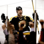 
              FILE - Boston Bruins captain Zdeno Chara, of Slovakia, celebrates with the fans in Boston after his shootout goal gave the Bruins a 4-3 win over the New York Islanders in a NHL game in Boston, Saturday, Feb. 10, 2007. Chara announced his retirement Tuesday, Sept. 20, 2022, after playing 21 seasons in the NHL and captaining the Boston Bruins to the Stanley Cup in 2011.(AP Photo/Winslow Townson, File)
            