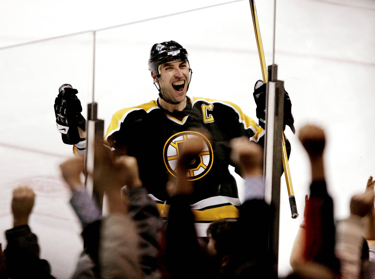 FILE - Boston Bruins captain Zdeno Chara, of Slovakia, celebrates with the fans in Boston after his...