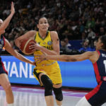 
              France's Gabby Williams, right, and France's Sarah Michel, left, attempt to stop Australia's Bec Allen during their game at the women's Basketball World Cup in Sydney, Australia, Thursday, Sept. 22, 2022. (AP Photo/Mark Baker)
            