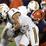 
              Illinois defensive lineman Keith Randolph Jr. (88) sacks Chattanooga quarterback Preston Hutchinson during the second half of an NCAA college football game Thursday, Sept. 22, 2022, in Champaign, Ill. (AP Photo/Charles Rex Arbogast)
            