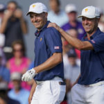 
              Jordan Spieth, left, and Justin Thomas celebrate winning the match on the 15th hole during their fourball match at the Presidents Cup golf tournament at the Quail Hollow Club, Saturday, Sept. 24, 2022, in Charlotte, N.C. (AP Photo/Julio Cortez)
            