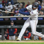 
              Minnesota Twins' Matt Wallner hits an RBI infield single off Chicago White Sox pitcher Johnny Cueto during the fourth inning of a baseball game Wednesday, Sept. 28, 2022, in Minneapolis. The Twins won 8-4. (AP Photo/Craig Lassig)
            