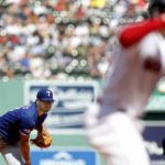 
              Texas Rangers pitcher Dane Dunning, left, delivers to Boston Red Sox' Xander Bogaerts, right, during the first inning of a baseball game at Fenway Park, Sunday, Sept. 4, 2022, in Boston.(AP Photo/Paul Connors)
            