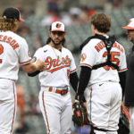 
              Baltimore Orioles pitcher Clonel Perez, center, is congratulated by Gunnar Henderson after recovering from being hit by a line drive in the leg to throw out Houston Astros Kyle Tucker in the eighth inning of a baseball game, Sunday, Sept. 25, 2022, in Baltimore. Also pictured is manager Brandon Hyde and catcher Adley Rutschman. The Astros won 6-3 in 11 innings. (AP Photo/Gail Burton)
            
