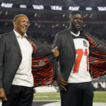 
              Former Cincinnati Bengals' Isaac Curtis and Willie Anderson were inducted into the Ring of Honor during the halftime of an NFL football game between the Cincinnati Bengals and the Miami Dolphins, Thursday, Sept. 29, 2022, in Cincinnati. (AP Photo/Joshua A. Bickel)
            