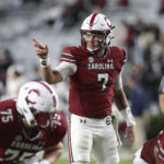 
              South Carolina quarterback Spencer Rattler (7) signals to a wide receiver during the second half of the team's NCAA college football game against South Carolina State on Thursday, Sept. 29, 2022, in Columbia, S.C. (AP Photo/Artie Walker Jr.)
            