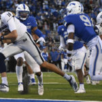 
              Nevada quarterback Nate Cox (16) scores a touchdown against Air Force on a keeper during the second quarter of an NCAA college football game Friday, Sept. 23, 2022, in Air Force Academy, Colo. (Christian Murdock/The Gazette via AP)
            