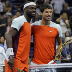 
              Frances Tiafoe, of the United States, and Carlos Alcaraz, of Spain, pose for a photo before playing in the semifinals of the U.S. Open tennis championships, Friday, Sept. 9, 2022, in New York. (AP Photo/John Minchillo)
            