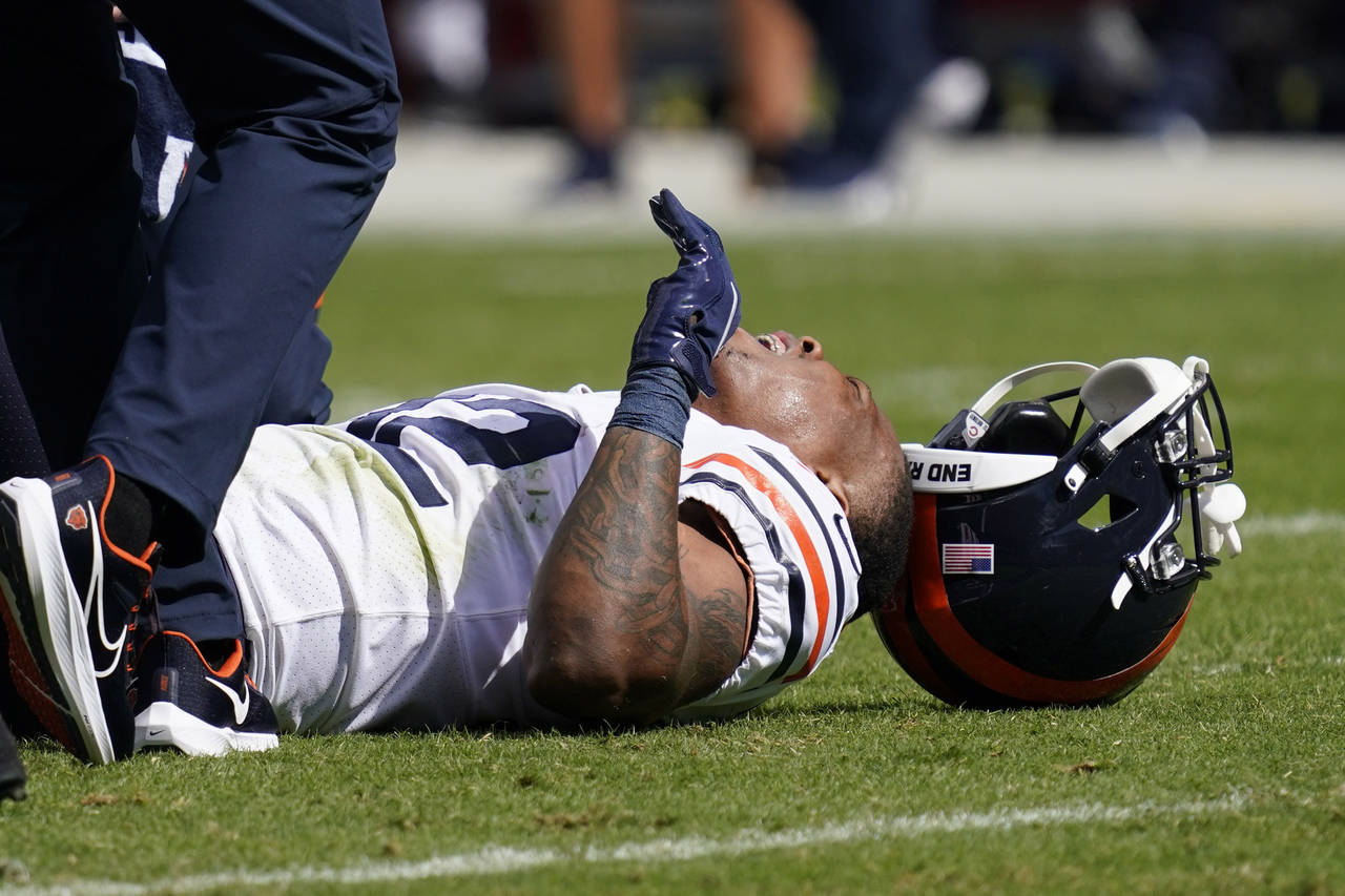 Chicago Bears running back David Montgomery reacts after being injured during the first half of an ...