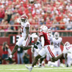 
              Oklahoma's Marvin Mims Jr. (17) misses a pass while under pressure from Nebraska's Quinton Newsome (6) during the first half of an NCAA college football game Saturday, Sept. 17, 2022, in Lincoln, Neb. (AP Photo/Rebecca S. Gratz)
            