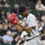 
              Cleveland Guardians starting pitcher Triston McKenzie applauds as he heads to the dugout after pitching in seven complete innings of a baseball game against the Chicago White Sox Wednesday, Sept. 21, 2022, in Chicago. McKenzie returned for the eighth. (AP Photo/Charles Rex Arbogast)
            