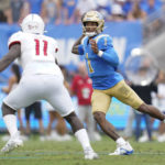 
              UCLA quarterback Dorian Thompson-Robinson (1) throws against South Alabama defensive lineman Jamie Sheriff (11) during the first half of an NCAA college football game in Pasadena, Calif., Saturday, Sept. 17, 2022. (AP Photo/Ashley Landis)
            