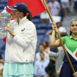 
              Iga Swiatek, of Poland, kisses the championship trophy after defeating Ons Jabeur, of Tunisia, to win the women's singles final of the U.S. Open tennis championships, Saturday, Sept. 10, 2022, in New York. (AP Photo/Frank Franklin II)
            