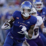 
              Kansas wide receiver Lawrence Arnold runs the ball during the first half of an NCAA college football game against Tennessee Tech Friday, Sept. 2, 2022, in Lawrence, Kan. (AP Photo/Charlie Riedel)
            