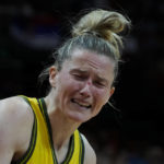 
              Australia's Sami Whitcomb reacts after she was hit in the face with the ball during their game at the women's Basketball World Cup against Serbia in Sydney, Australia, Sunday, Sept. 25, 2022. (AP Photo/Mark Baker)
            