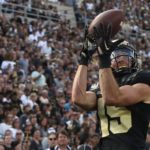 
              Purdue wide receiver Charlie Jones (15) catches a pass for a touchdown during an NCAA college football game against Indiana State, Saturday, Sept. 10, 2022, in West Lafayette, Ind. (Alex Martin/Journal & Courier via AP)
            