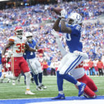 
              Indianapolis Colts tight end Jelani Woods (80) makes a touchdown reception against Kansas City Chiefs' Juan Thornhill during the second half of an NFL football game, Sunday, Sept. 25, 2022, in Indianapolis. (AP Photo/AJ Mast)
            