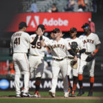 
              San Francisco Giants' Wilmer Flores, Brandon Crawford, Mike Yastrzemski, Thairo Estrada and Lewis Brinson, from left, celebrate the team's 4-1 victory against the Atlanta Braves in a baseball game in San Francisco, Wednesday, Sept. 14, 2022. (AP Photo/Godofredo A. Vásquez)
            