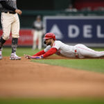 
              Philadelphia Phillies' Bryce Harper slides  to steal second during the third inning of the first baseball game of a doubleheader against the Washington Nationals, Friday, Sept. 30, 2022, in Washington. (AP Photo/Nick Wass)
            