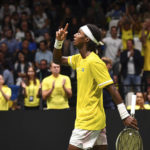 
              Sweden's Mikael Ymer celebrates after beating Italy's Janni Sinner during their Davis Cup tennis match at the Unipol Arena in Bologna, Italy, Sunday, Sept. 18, 2022. (Massimo Paolone/LaPresse via AP)
            