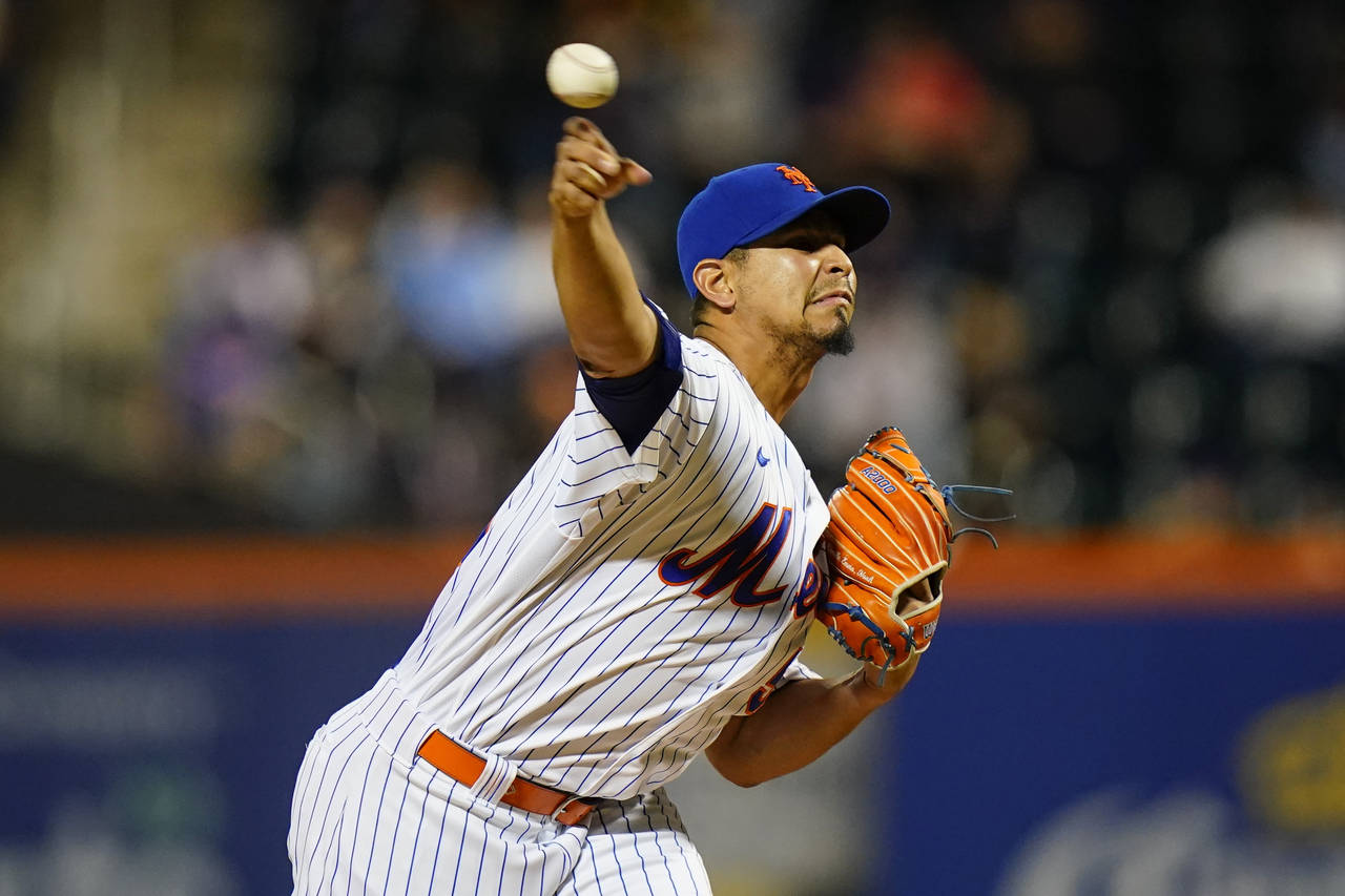 New York Mets' Carlos Carrasco pitches during the first inning of the team's baseball game against ...