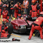 
              Ferrari mechanics wait for a tire to mount on the car of driver Carlos Sainz of Spain during the Formula One Dutch Grand Prix auto race, at the Zandvoort racetrack, in Zandvoort, Netherlands, Sunday, Sept. 4, 2022. (Christian Bruna/Pool via AP)
            