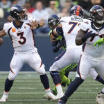 
              Denver Broncos quarterback Russell Wilson (3) passes for a touchdown against the Seattle Seahawks during the first half of an NFL football game, Monday, Sept. 12, 2022, in Seattle. (AP Photo/Stephen Brashear)
            