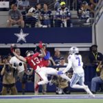 
              Tampa Bay Buccaneers wide receiver Mike Evans (13) catches a touchdown pass as Dallas Cowboys cornerback Trevon Diggs (7) defends in the second half of a NFL football game in Arlington, Texas, Sunday, Sept. 11, 2022. (AP Photo/Ron Jenkins)
            