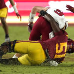 
              Fresno State quarterback Jake Haener, top, is sacked by Southern California defensive lineman Solomon Byrd during the second half of an NCAA college football game Saturday, Sept. 17, 2022, in Los Angeles. Haener was injured on the play and had to leave the game. (AP Photo/Mark J. Terrill)
            