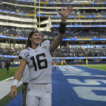 
              Jacksonville Jaguars quarterback Trevor Lawrence (16) waves after an NFL football game against the Los Angeles Chargers in Inglewood, Calif., Sunday, Sept. 25, 2022. (AP Photo/Mark J. Terrill)
            