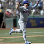 
              New York Mets designated hitter Pete Alonso (20) reacts after a home run in the fourth inning of a baseball game against the Oakland Athletics in Oakland, Calif., on Sunday, Sept. 25, 2022. (AP Photo/Scot Tucker)
            