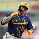
              Milwaukee Brewers' Kolten Wong (16) rounds third base after hitting a two-run home run during the second inning of the team's baseball game against the Cincinnati Reds on Thursday, Sept. 22, 2022, in Cincinnati. (AP Photo/Jeff Dean)
            