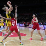 
              Australia's Kristy Wallace shoots for goal as Canada's Nirra Fields attempts to block during their bronze medal game at the women's Basketball World Cup in Sydney, Australia, Saturday, Oct. 1, 2022. (AP Photo/Mark Baker)
            