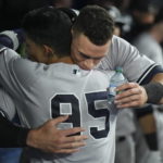
              New York Yankees' Aaron Judge, rear, celebrates with Oswaldo Cabrera after his 61st home run of the season, a two-run shot against the Toronto Blue Jays during the seventh inning of a baseball game Wednesday, Sept. 28, 2022, in Toronto. (Nathan Denette/The Canadian Press via AP)
            