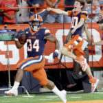 
              Syracuse running back Sean Tucker (34) runs on the way to a touchdown against Louisville during an NCAA college football game Saturday, Sept. 3, 2022, in Syracuse N.Y. (Dennis Nett/The Post-Standard via AP)
            