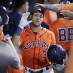 
              Houston Astros' Jeremy Pena (3) is congratulated in the dugout after his home run against the Los Angeles Angels during the sixth inning of a baseball game Friday, Sept. 9, 2022, in Houston. (AP Photo/Michael Wyke)
            