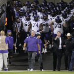 
              TCU coach Sonny Dykes leads the team onto the field for an NCAA college football game against Colorado on Friday, Sept. 2, 2022, in Boulder, Colo. (AP Photo/David Zalubowski)
            