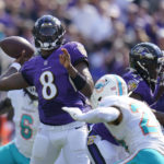 
              Baltimore Ravens quarterback Lamar Jackson (8) aims a pass during the first half of an NFL football game against the Miami Dolphins, Sunday, Sept. 18, 2022, in Baltimore. (AP Photo/Julio Cortez)
            