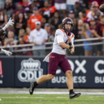 
              Virginia Tech quarterback Grant Wells (6) throws a pass as  Old Dominion defensive tackle Alonzo Ford Jr. (5) pursues during the first half of an NCAA college football game Friday, Sept. 2, 2022, in Norfolk, Va. (AP Photo/Mike Caudill)
            
