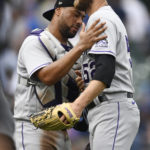 
              Colorado Rockies closing pitcher Daniel Bard (52) celebrates with catcher Elias Diaz, left, after defeating the Chicago Cubs 3-1 in a baseball game, Saturday, Sept. 17, 2022, in Chicago. (AP Photo/Paul Beaty)
            
