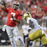 
              Ohio State quarterback C.J. Stroud throws while being pressured by Notre Dame safety DJ Brown during the second quarter of an NCAA college football game Saturday, Sept. 3, 2022, in Columbus, Ohio. (AP Photo/David Dermer)
            